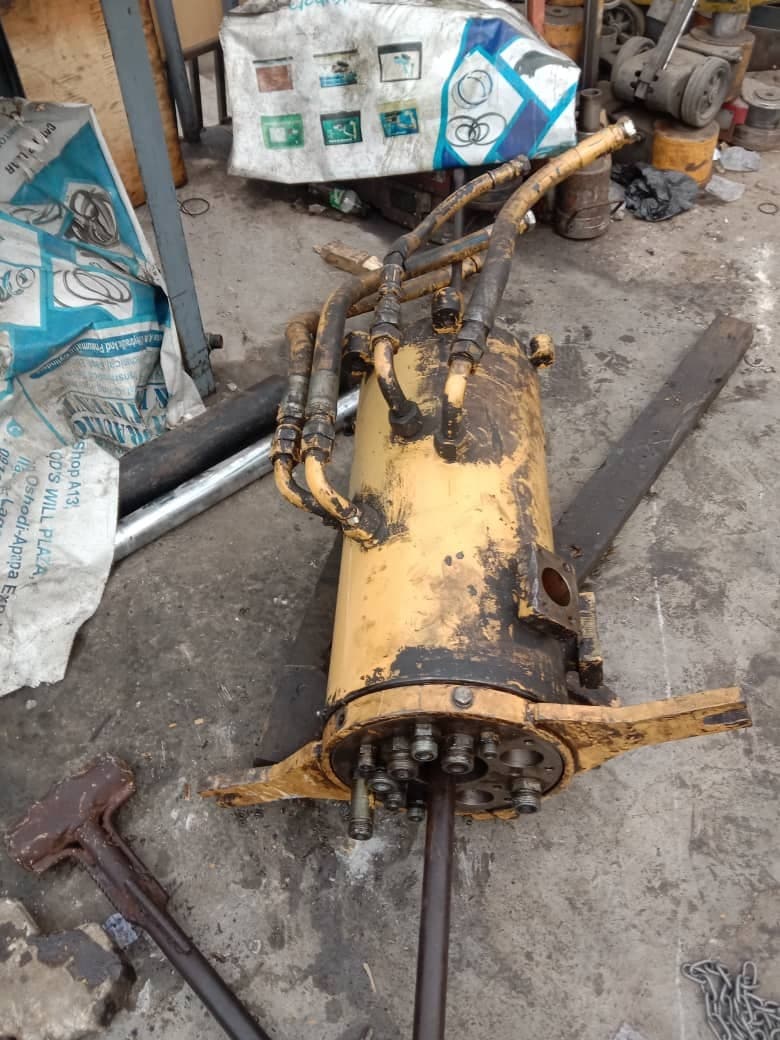 Hydraulic cylinder stripped down on the workshop floor